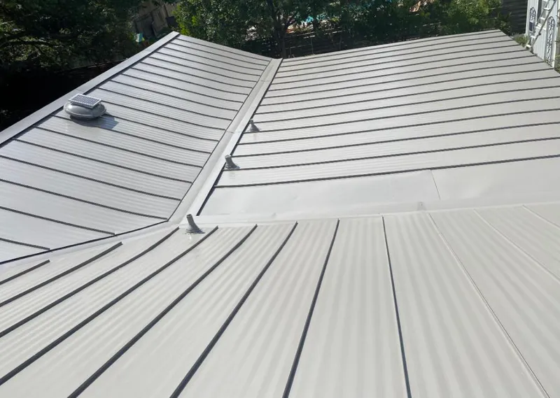 Solar attic fan installed on a metal roof for Roof Ventilation in Skidaway Island